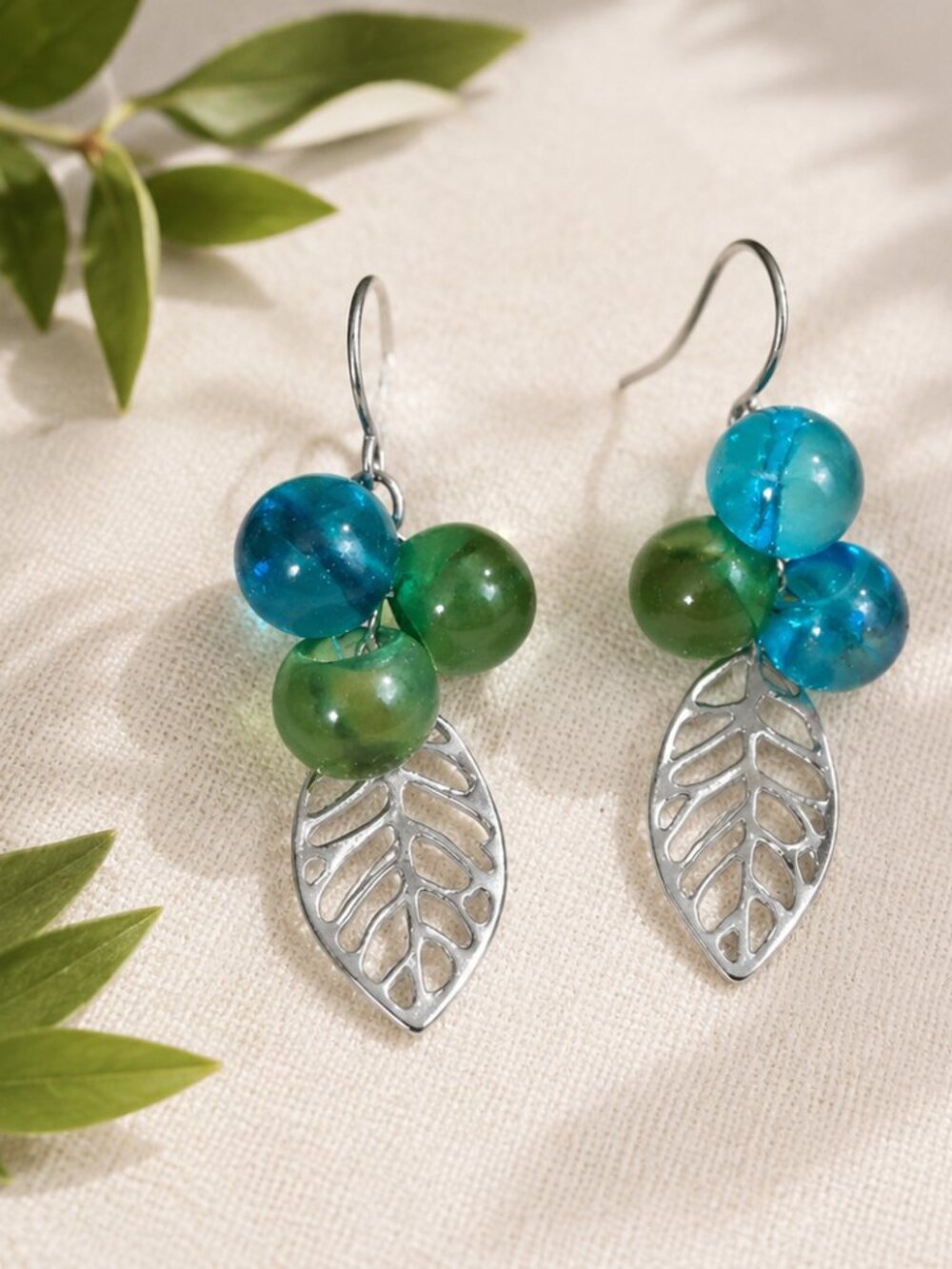Handmade, one-of-a-kind, Ocean blue Earring with leaf charm, titanium hooks